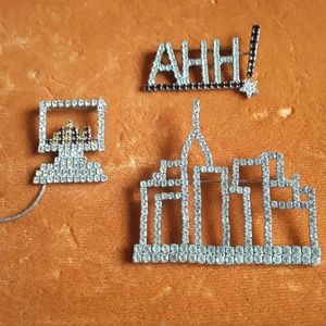 Three rhinstones brooches